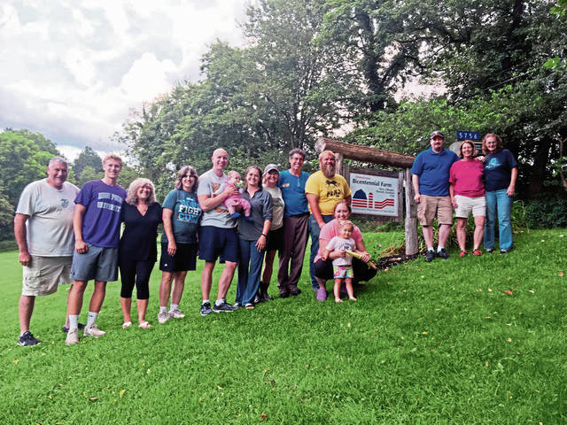 The Gearhard Family with the bicentennial farm sign